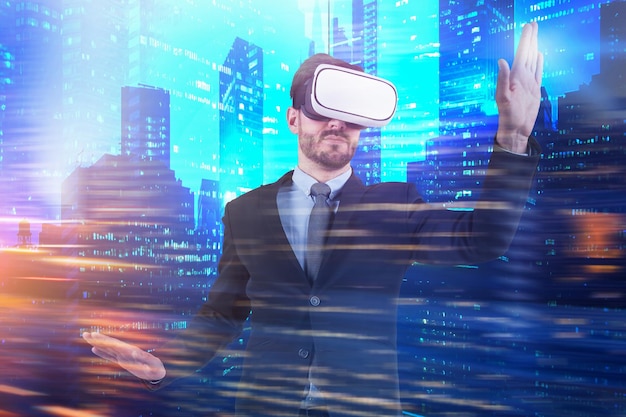 Bearded young businessman using vr glasses in modern city. Concept of future technology. Toned image double exposure