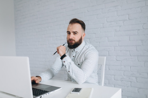 beared business man thinking