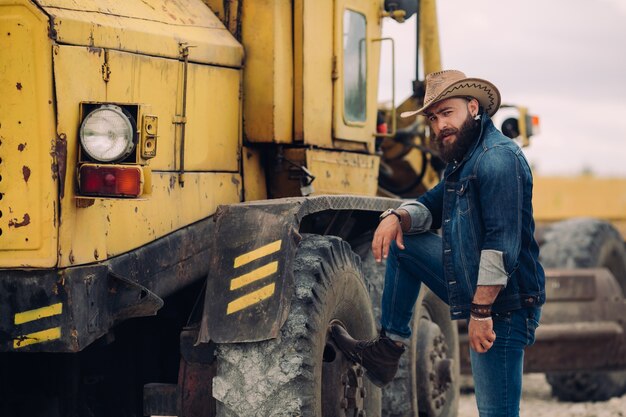 beared man with hat modeling