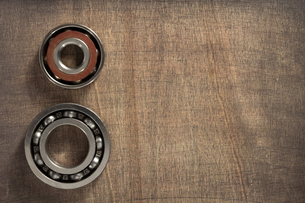 Bearings tool at wooden background surface