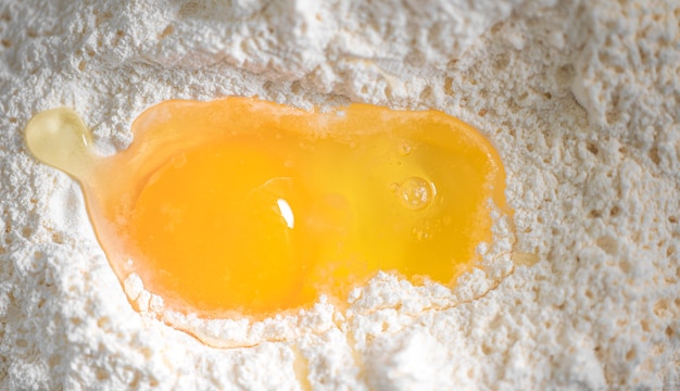 Beaten egg on the surface of the flour