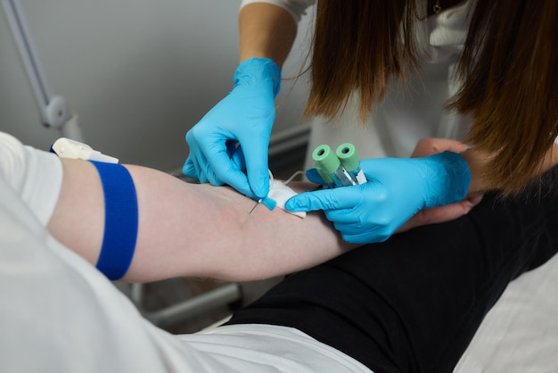 Beautician doctors hands put test tube with blood in centrifuge container rejuvenation plasmolifting