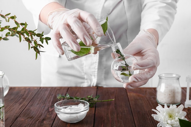 Beautician preparing natural cosmetics, closeup