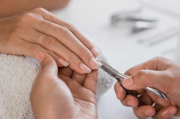 Beautician using a cuticle pusher