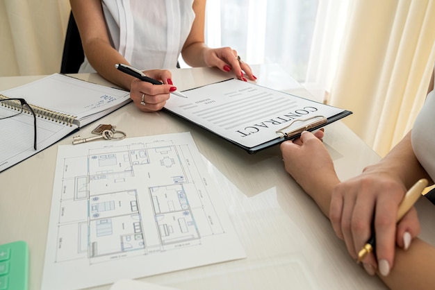 The beauties of the designer with a beautiful style of clothing are perfect working on the design of the new color of the room Business design concept