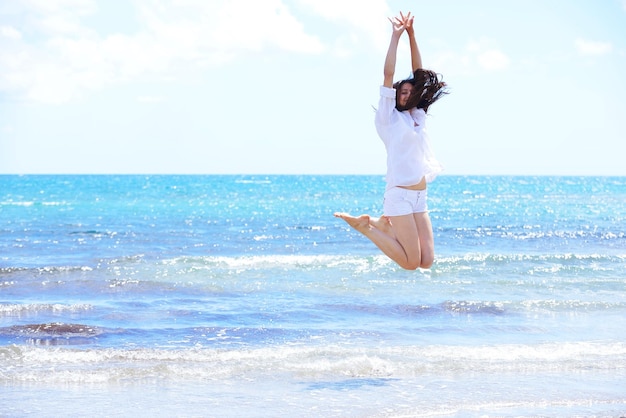 beautifel and happy woman girl on beach have fun and relax on summer vacation  over the beautiful tropical sea