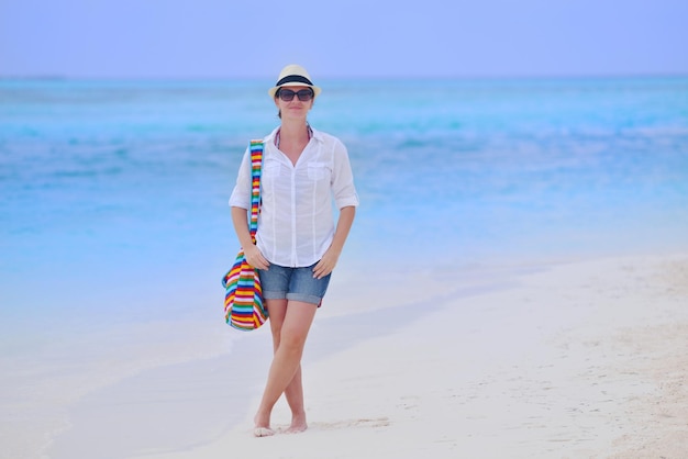 beautifel and happy woman girl on beach have fun and relax on summer vacation  over the beautiful tropical sea