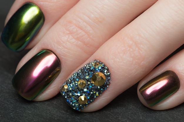 Beautifil Colorful manicure with rhinestone. Nail Design. Close-up.