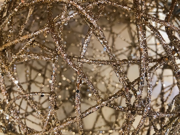 Foto struttura ruvida del tessuto dell'oro bello della scintilla 3d nell'uso alto vicino per fondo