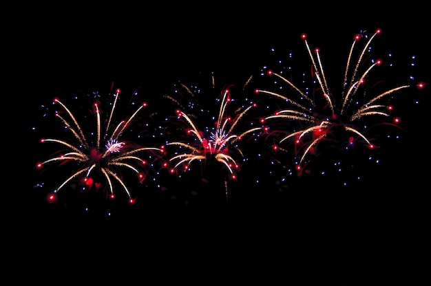 Beautiful abstract pattern with salute fireworks on dark background