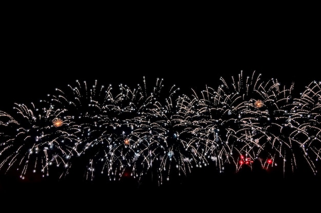 Beautiful abstract pattern with salute fireworks on dark background