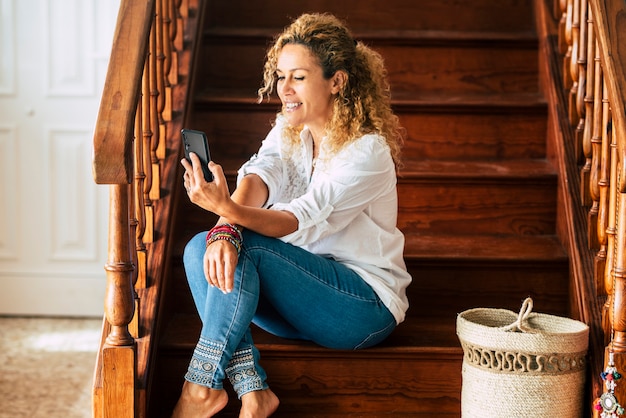 Beautiful adult woman at home in video call conference