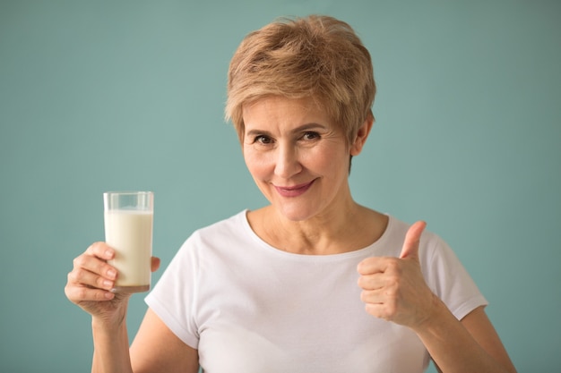 beautiful adult woman with a glass of milk