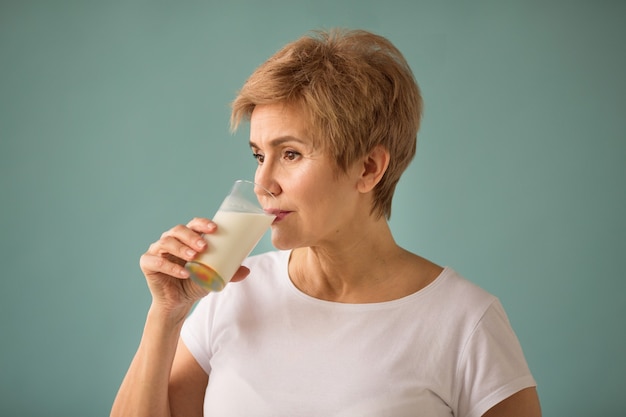 beautiful adult woman with a glass of milk