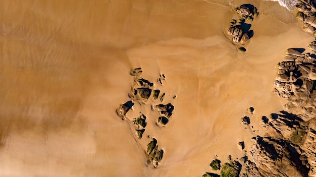 Beautiful aerial view of a beach with waves 