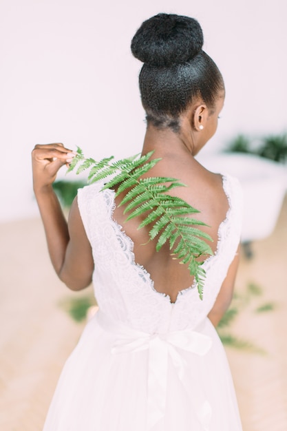 Beautiful african american bride with fern