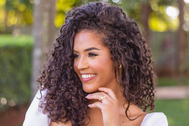 Beautiful afro woman with curly hair smiling