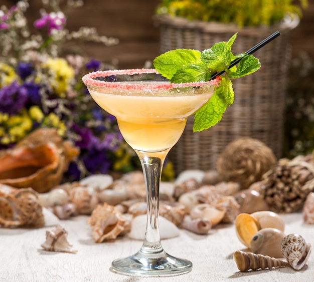 Beautiful alcoholic cocktail, on a wooden table