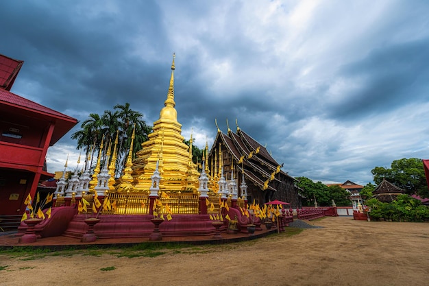 Beautiful Ancient golden color Pagoda in the Phan Tao temple  is a Buddhist temple in the historic centre tourist attraction an ancient Thai art and is Public places in Chiang MaiThailand