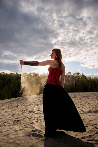 Beautiful anime woman in the sand