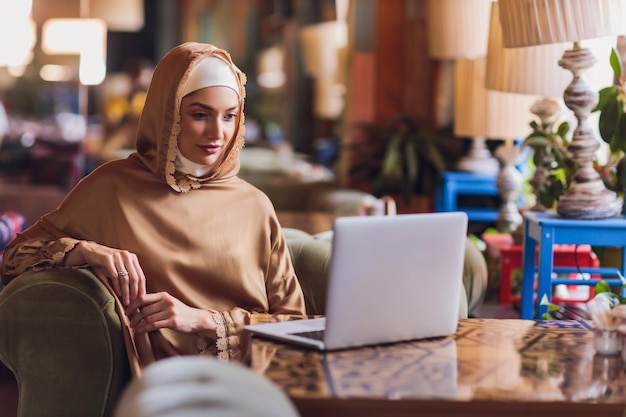 Beautiful arabic business woman working on computer