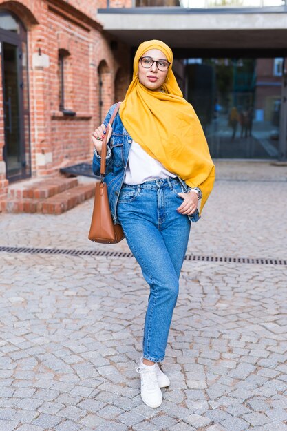 Beautiful Arabic muslim woman wearing yellow hijab