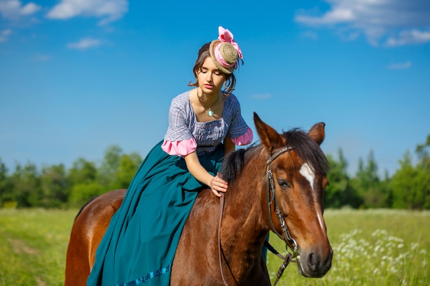 beautiful aristocrat in a dress on a horse