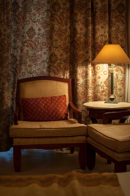 Beautiful armchair and lamp in a hotel room