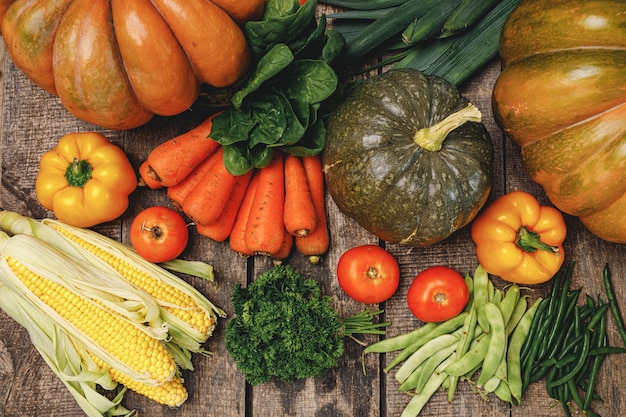 Beautiful arrengament of autumn vegetables on wooden table