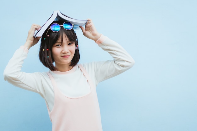 beautiful Asia woman, teen girl reading book with happy in free time, holiday.