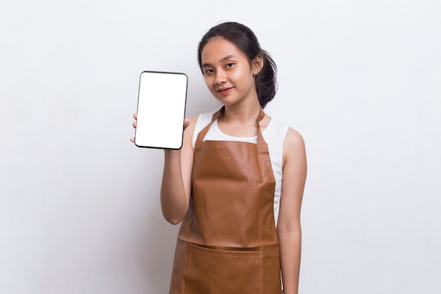 Beautiful Asian Barista waitress demonstrating mobile cell phone on white background