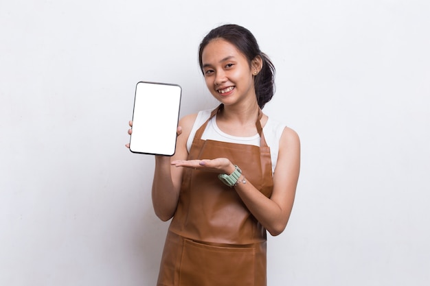 Beautiful Asian Barista waitress demonstrating mobile cell phone on white background