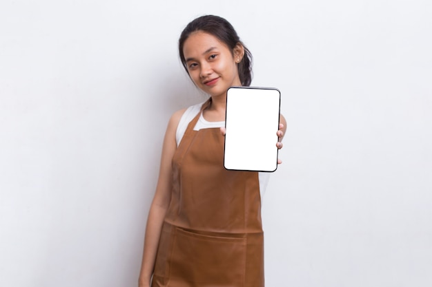 Beautiful Asian Barista waitress demonstrating mobile cell phone on white background