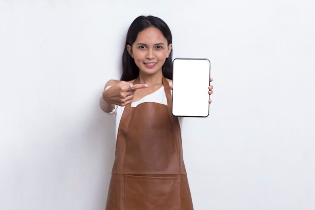 Beautiful Asian Barista waitress demonstrating mobile cell phone on white background