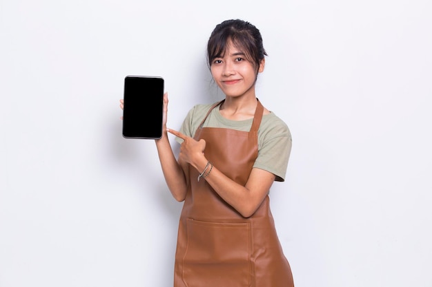 Beautiful Asian Barista waitress demonstrating mobile cell phone on white background