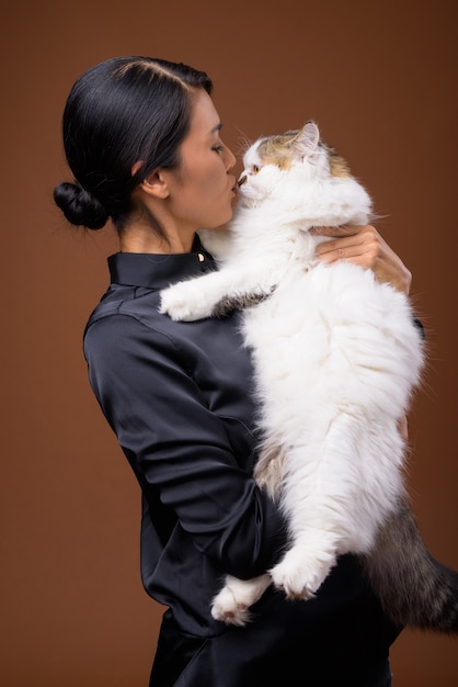  beautiful Asian businesswoman with pet cat