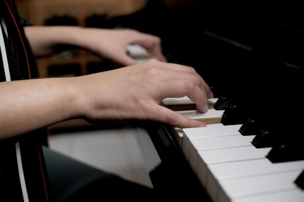 Beautiful asian girl learn to play piano