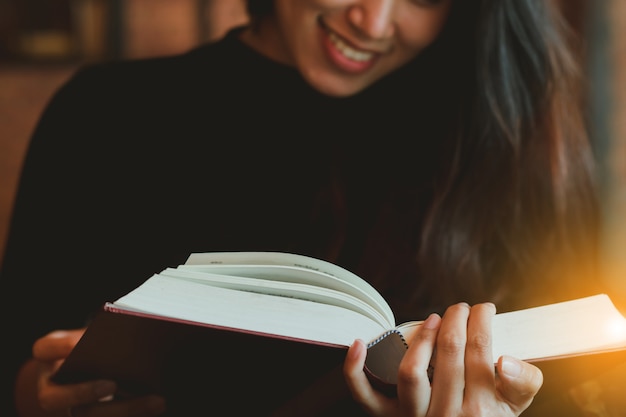 beautiful Asian girl reading book 