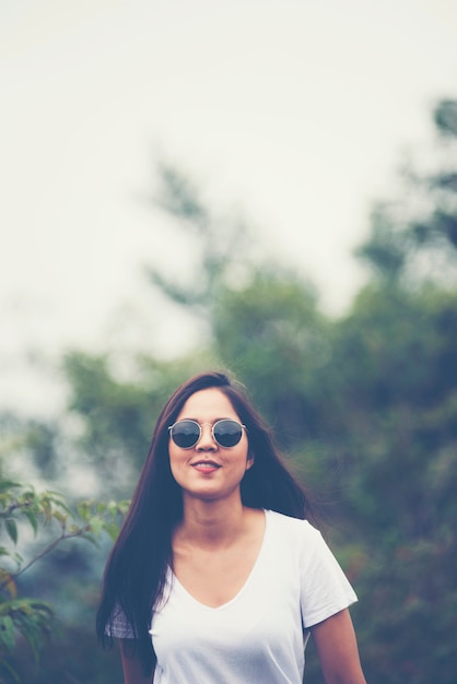 Beautiful Asian girl smiles in the garden, nature outdoor concept