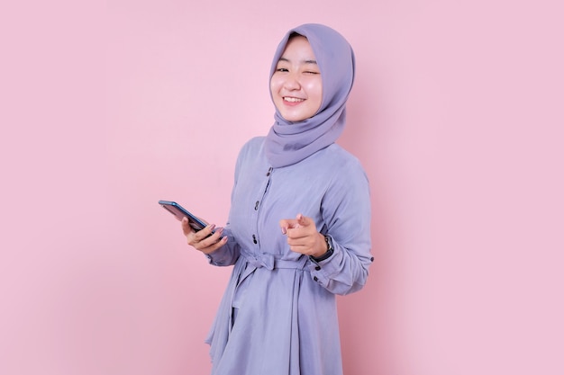 Beautiful Asian Muslim woman in a blue dress