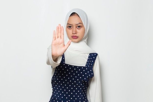 beautiful asian muslim woman show stop hands gesture