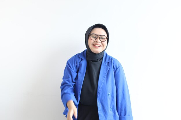 beautiful Asian Muslim woman wearing glasses and blue blazer with happy smiling face expression