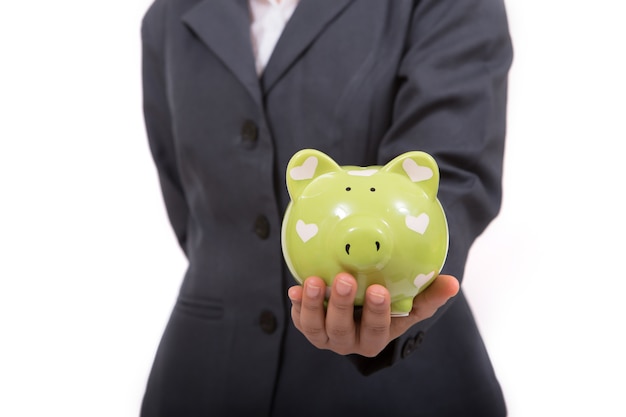 Beautiful asian woman holding piggy bank