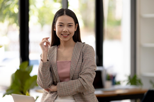 Beautiful Asian woman is a businesswoman who leads a new generation of startups a woman who runs and manages a business plan to build confidence and stability in business womanled business concept