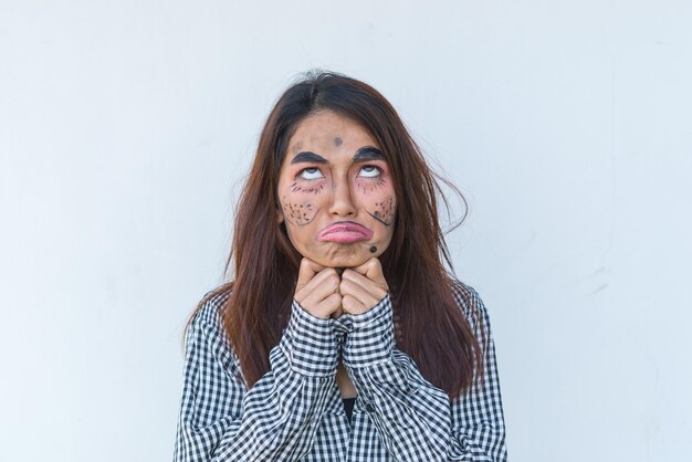 Beautiful asian woman make up face joke on white backgroundThailand people pose for take a picture