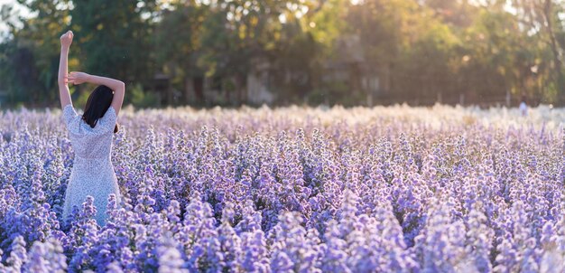 Beautiful asian woman relax in margaret flower fieldbeautiful in nature