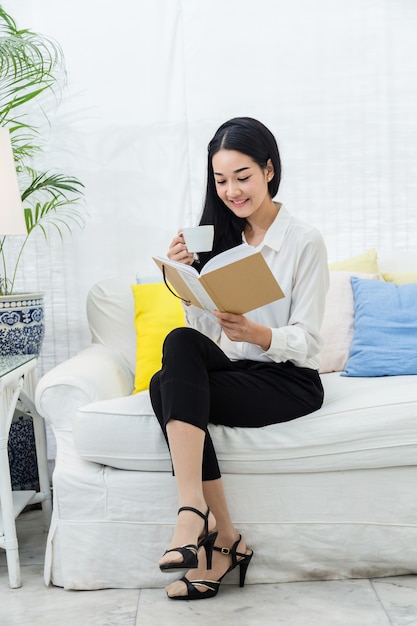 beautiful asian woman sit relax reading book 