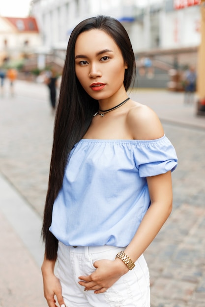 Beautiful Asian woman walking in the city