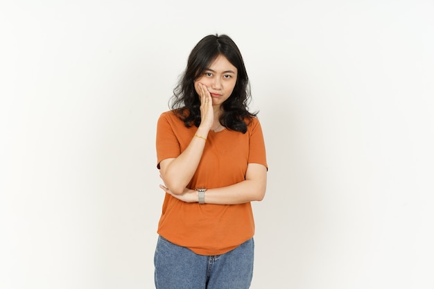 Beautiful Asian Woman Wearing Orange Color TShirt toothache gesture Isolated On White Background