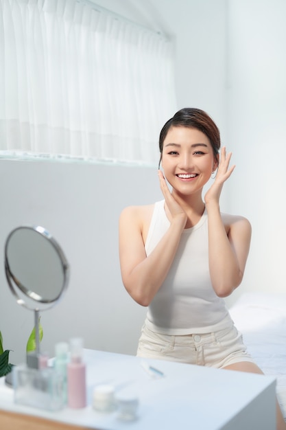 Beautiful asian woman on white background